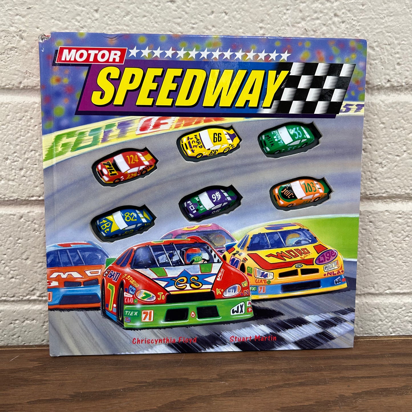 Motor Speedway *tear in top corner